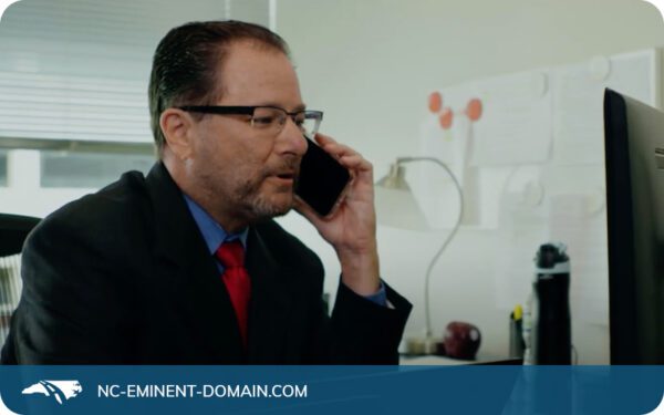 Eminent domain attorney Ken Sack speaking on the phone with a client.