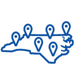 Blue icon of the state of North Carolina with location pins.