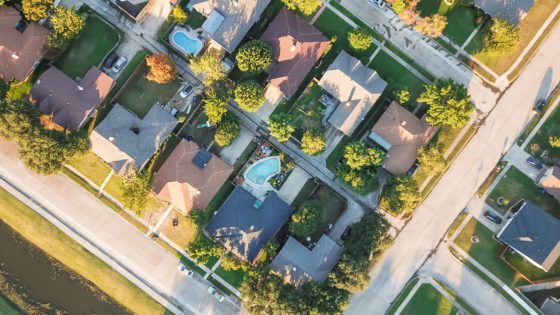 Panorama,Aerial,Vertical,View,Residential,Houses,With,Swimming,Pool,In