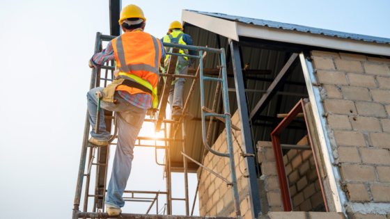 Construction,Worker,Wearing,Safety,Harness,And,Safety,Line,Working,On