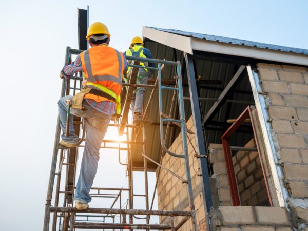 Construction,Worker,Wearing,Safety,Harness,And,Safety,Line,Working,On
