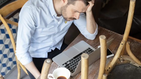 A cafe owner worried about his small business.